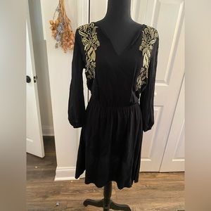 Black long sleeve dress with gold detail